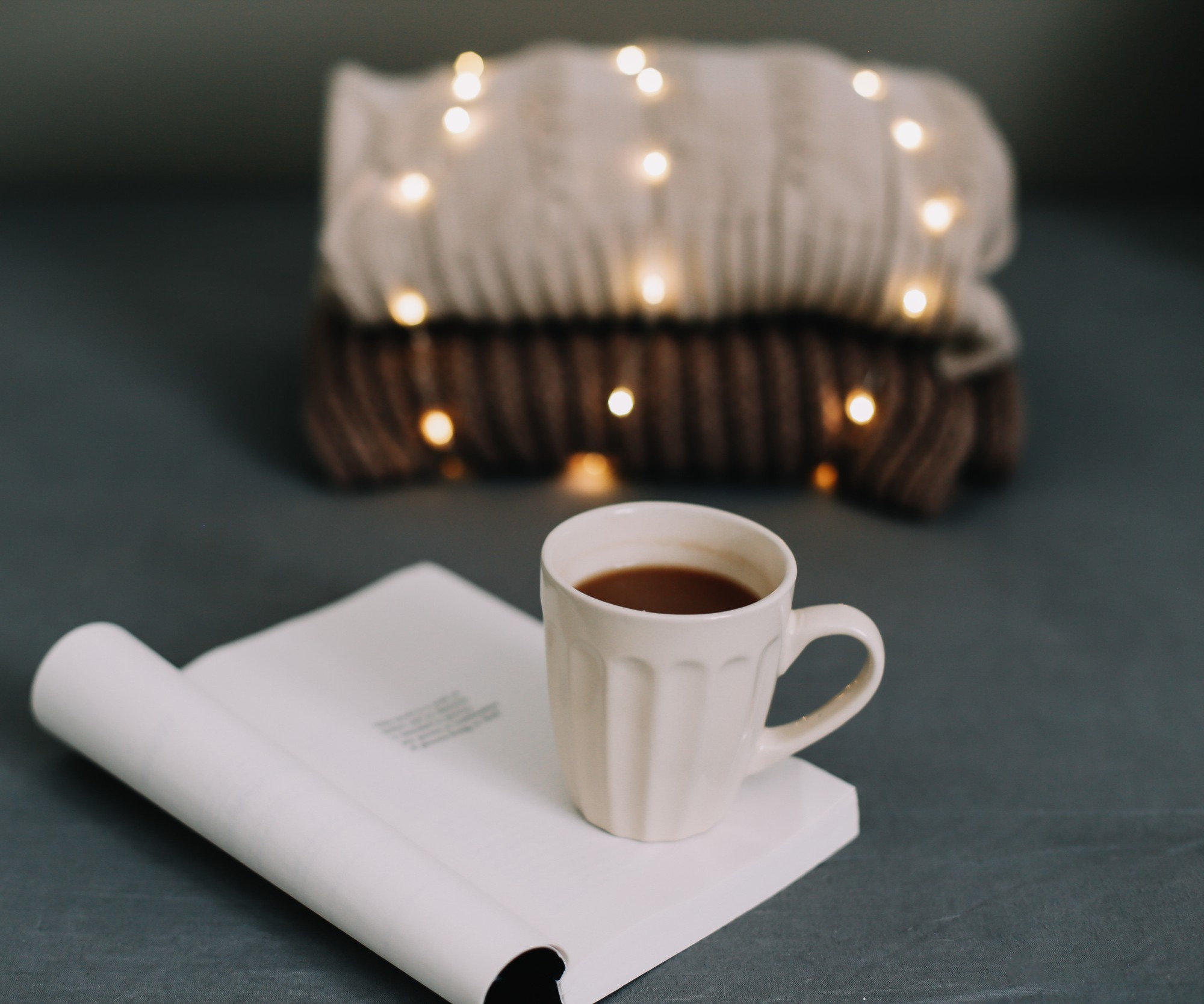 Cozy evening routine tea book warm lamp