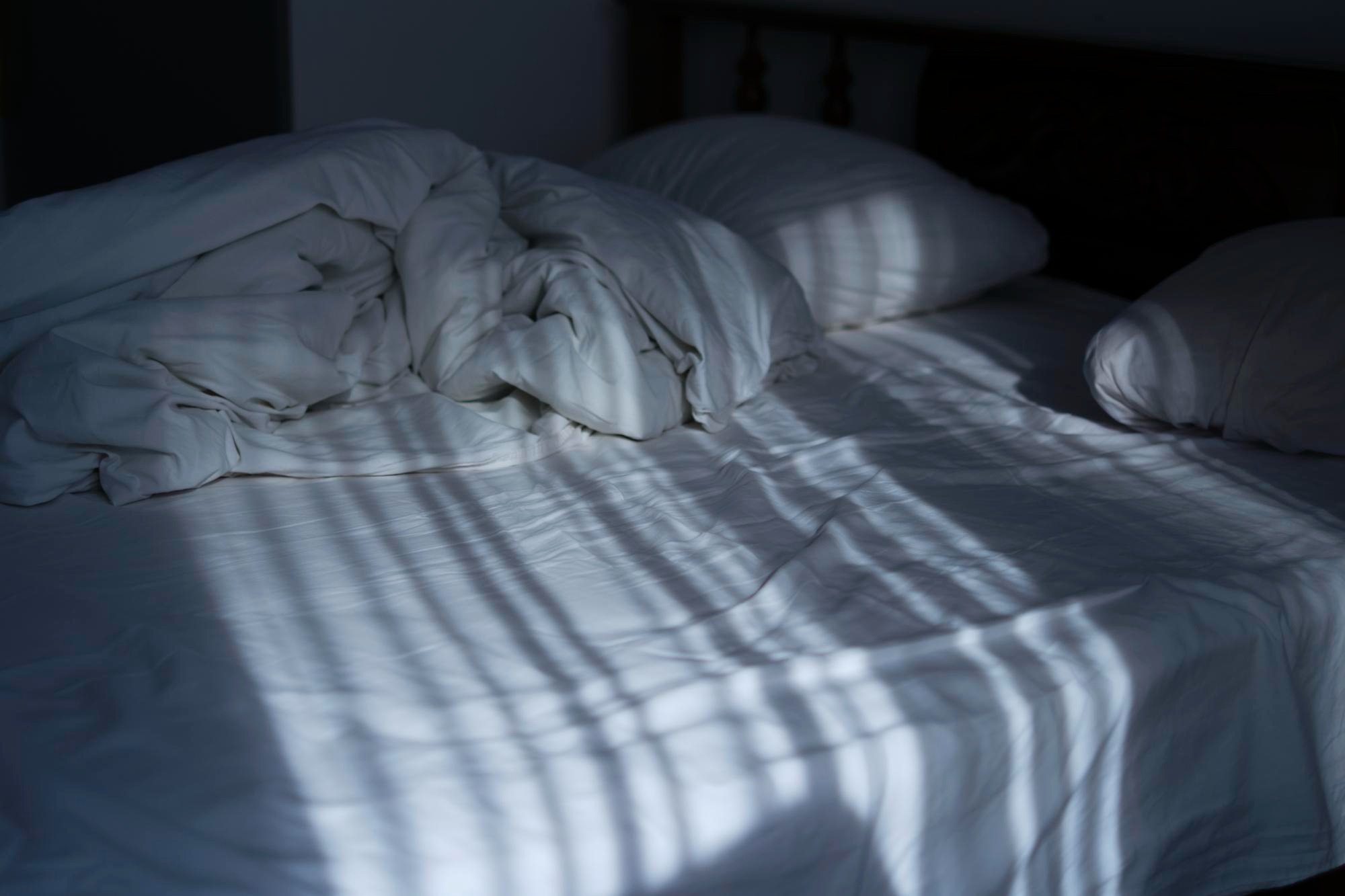 Soft Linen Bed with soft moonlight shadows.